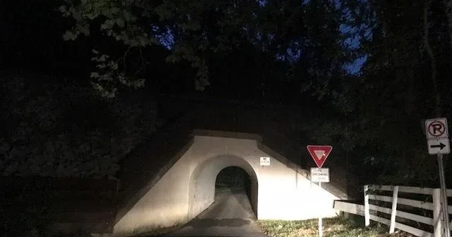 The Bunny Man Bridge railroad overpass tunnel at night